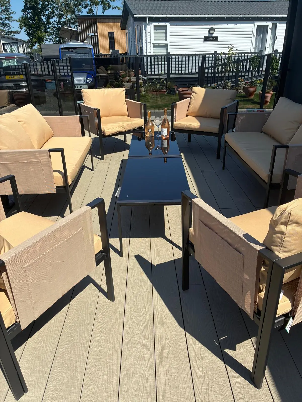 Outdoor lounge furniture on composite decking with glass balustrade