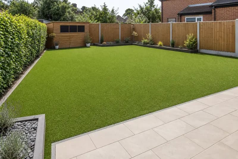 Artificial grass lawn in family garden